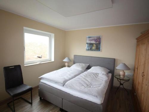 Ένα ή περισσότερα κρεβάτια σε δωμάτιο στο Klabautermann Maywald