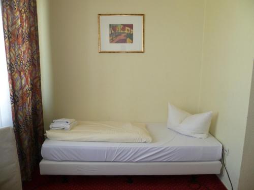Cama ou camas em um quarto em Domo Hotel Mondial