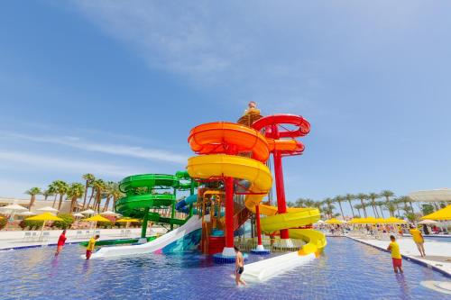 a water park with a water slide in the water at Beach Albatros The Club - Aqua Park in Hurghada