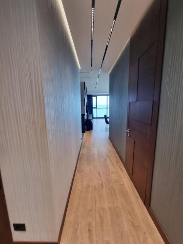 an office corridor with a corridorngth at Premium apartment in Porta Batumi Tower in Batumi