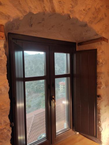 a window in a room with a view at Casagli Luxury Suites in Dhimitsana