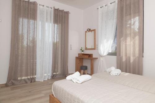 Elixrysos Apartment 1にあるベッド