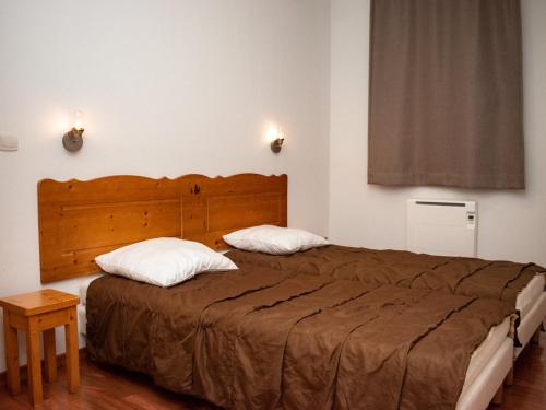 Кровать или кровати в номере Appartement Le Dévoluy, 3 pièces, 6 personnes - FR-1-504-454