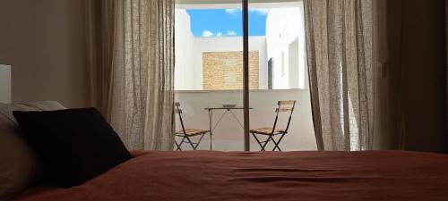 Ένα ή περισσότερα κρεβάτια σε δωμάτιο στο Villa Marcel