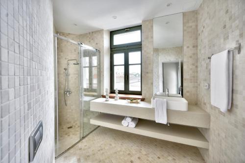 a bathroom with a shower and a sink and a mirror at Charming Athens Villa 1 Bedroom Villa Kyoraku Panoramic Acropolis View Platia Agion Asomaton in Athens