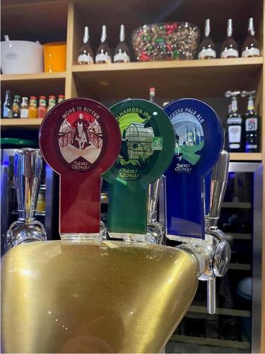 three different colored awards sitting on top of a sink at World Hotel in Saint-Vulbas
