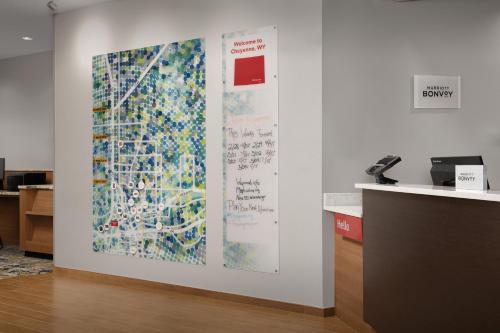 an office with a large painting on the wall at TownePlace Suites by Marriott Cheyenne Southwest/Downtown Area in Cheyenne
