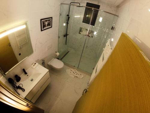 a bathroom with a shower and a toilet and a sink at Villa Riad Arabic House Pool & Spa in Marrakech