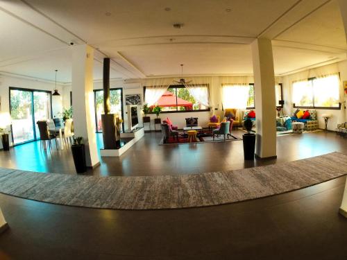 a large living room with a rug on the floor at Villa Riad Arabic House Pool & Spa in Marrakech
