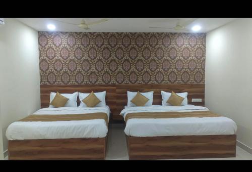 Lova arba lovos apgyvendinimo įstaigoje Siddi Vinayaka hotel