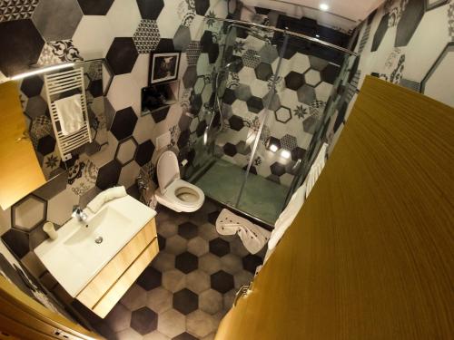 a bathroom with a shower and a sink and a toilet at Villa Riad Arabic House Pool & Spa in Marrakech