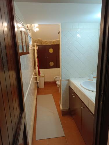 a small bathroom with a sink and a toilet at Marlene in Torre a Mare