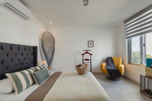 Ένα ή περισσότερα κρεβάτια σε δωμάτιο στο Casa Moderna en Playa Norte Isla Mujeres