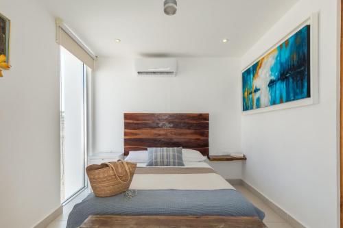 Ένα ή περισσότερα κρεβάτια σε δωμάτιο στο Casa Moderna en Playa Norte Isla Mujeres