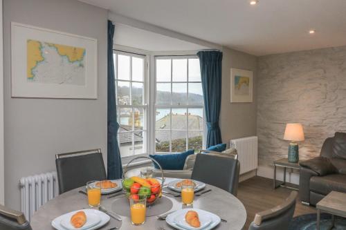 a living room with a table with fruit on it at Queens View in Dartmouth