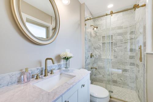 a bathroom with a sink and a shower with a mirror at Family-Friendly Villa Park Home 16 Mi to Chicago! in Villa Park