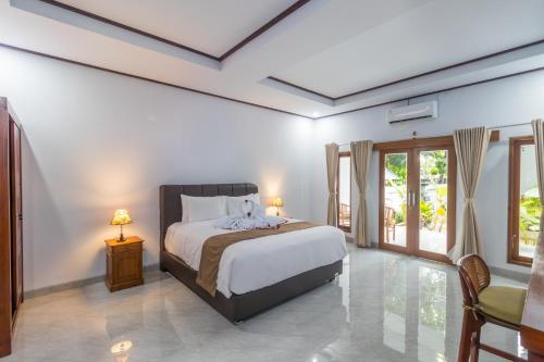 Ένα ή περισσότερα κρεβάτια σε δωμάτιο στο Amed Permai Home Stay