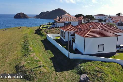 an aerial view of a house next to the ocean at Casa do Ilhéu in Vila Franca do Campo