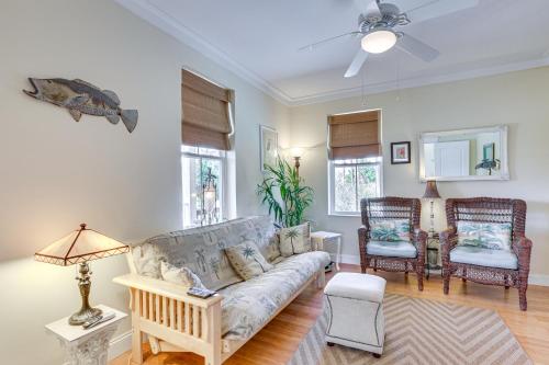 a living room with a couch and two chairs at Lovely Carrabelle Home with Lake Views and Pool Access in Carrabelle