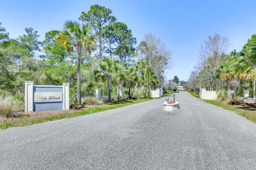 an empty road with a boat in the middle at Lovely Carrabelle Home with Lake Views and Pool Access in Carrabelle