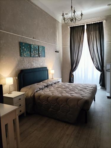 Katil atau katil-katil dalam bilik di Rossi Hotel
