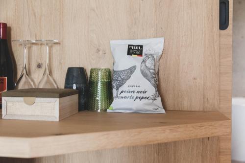 a bag of food sitting on top of a shelf at Wood (Forestia) in Theux