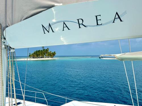 a view of a small island in the ocean from a boat at "Marea" Sunreef 62 Catamaran with Crew all inclusive in Isla Wichitupo Grande
