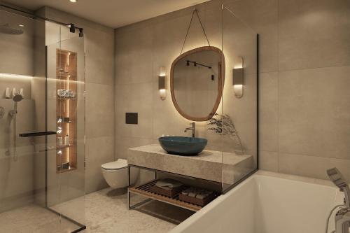 a bathroom with a sink and a tub and a mirror at The Isolano, Cres, Autograph Collection in Cres