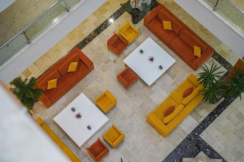 an overhead view of a meeting room with tables and chairs at Prestige Hotel & Spa in Tetouan