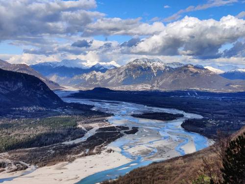 a view of a river with mountains in the background at Ai Priori in Gemona del Friuli