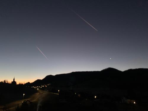 a view of a city at night with the sky at Chez Svanette B&B Villa Sonnglück in Zullwil