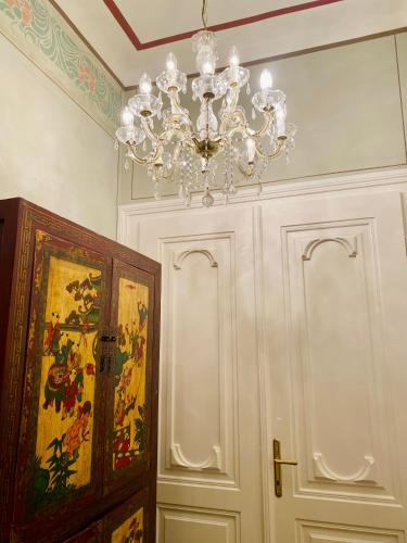 a chandelier hanging from a ceiling in a room at Gut Purbach in Purbach am Neusiedlersee