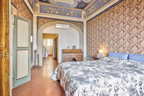 Tempat tidur dalam kamar di Il Dipinto - Together in Tuscany