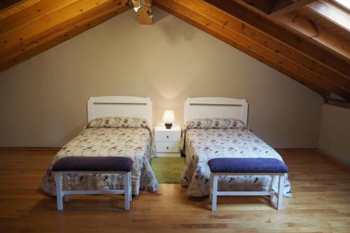 two beds in a room with a attic at Casa Pepe El Segador - VV-1054-AS in San Juan de la Arena
