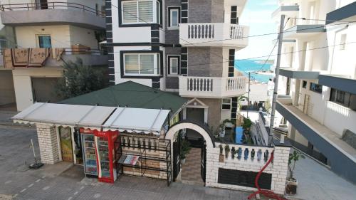 a building with a store in front of it at Villa Xika in Sarandë