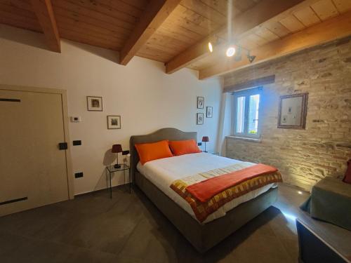 Posteľ alebo postele v izbe v ubytovaní B&B Locanda Montefabbri