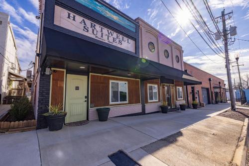 a building on a street with a sign on it at Hartwell Suites in Hartwell