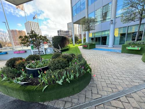a garden in front of a building at Rafayel Hotel & Spa in London
