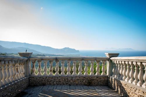 a balcony with a view of the ocean at Tenuta Pietravera in Furnari