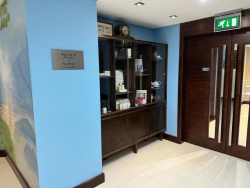a room with a clock on the wall at Rafayel Hotel & Spa in London