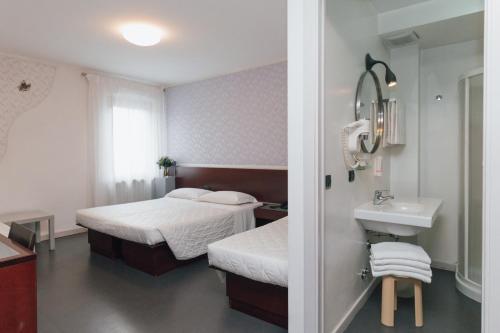 Uma cama ou camas num quarto em Hotel Gattopardo