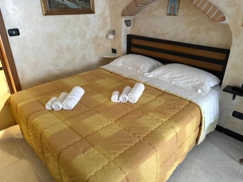 מיטה או מיטות בחדר ב-Casa vacanze Muruidda