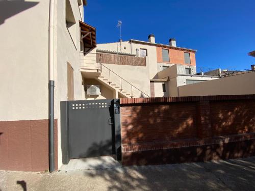 a gate in front of a building with a fence at Can Pirrot Salitja in Salitja