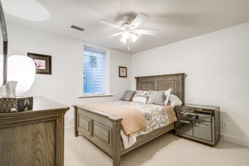a bedroom with a bed and a ceiling fan at Convenient North Bend Apt Half-Mi to Notre Dame! in South Bend