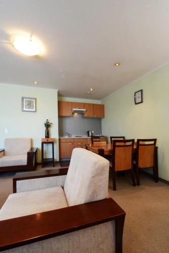a living room with a couch and a table at Narantuul Hotel in Ulaanbaatar