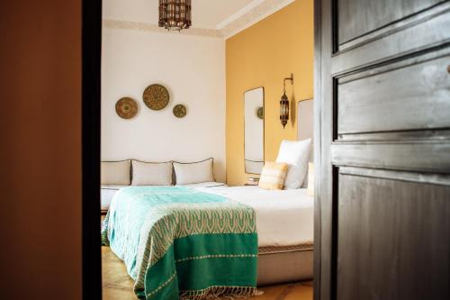 Voodi või voodid majutusasutuse Riad Deha & Spa toas