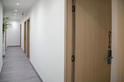 a hallway with a door with the on it at Celia Residence in Athens