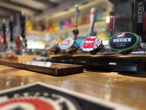 a group of clocks sitting on top of a counter at The Half Moon Inn Rushall IP21 4QD in Pulham Saint Mary the Virgin