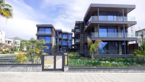 a building with a sign in front of it at Bodrum Ada Apart Otel Turgutreis in Mugla