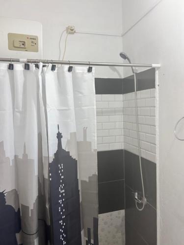 a shower curtain in a bathroom with a city at Apart Pelusa in Fray Bentos